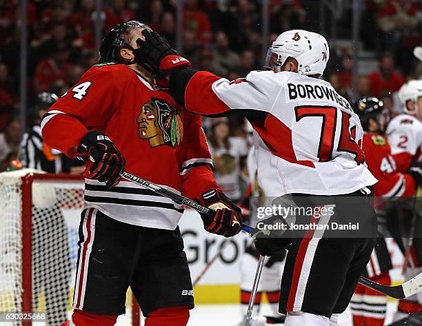 Mark Borowiecki of the Ottawa Senators shoves Richard Panik of the Chicago Blackhawks in the face at the United Center on December 20, 2016 in...