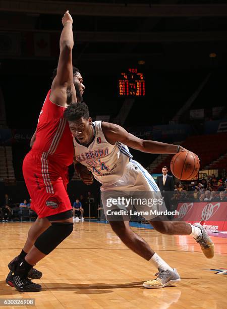 Dakari Johnson of the Oklahoma City Blue drives to the basket against Joshua Smith of the Rio Grande Valley Vipers during an NBA D-League game on...