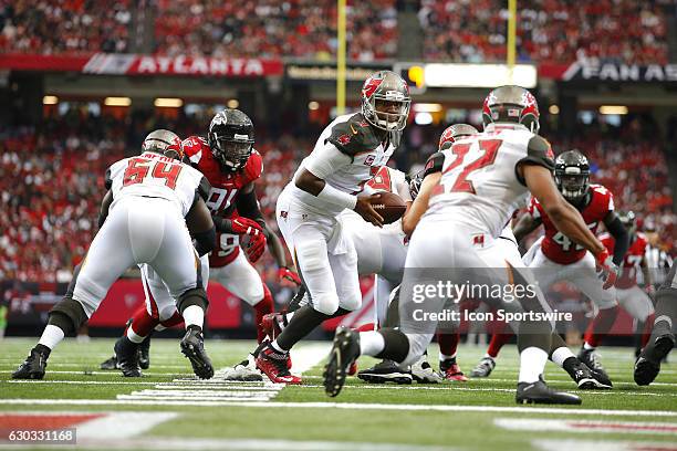 Tampa Bay Buccaneers quarterback Jameis Winston hands off to running back Doug Martin in the Tampa Bay Buccaneers 31-24 victory over the Atlanta...