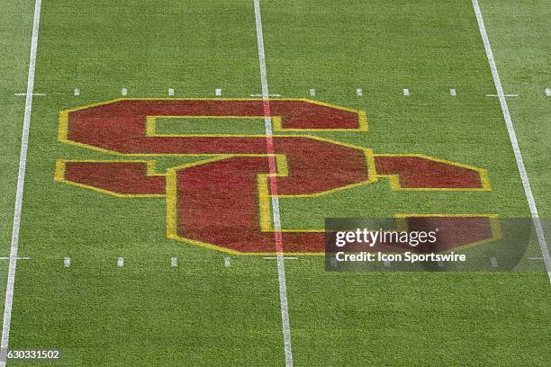 The USC Trojans logo on the field during an NCAA football game between the Utah State Aggies and the USC Trojans at the Los Angeles Memorial Coliseum...