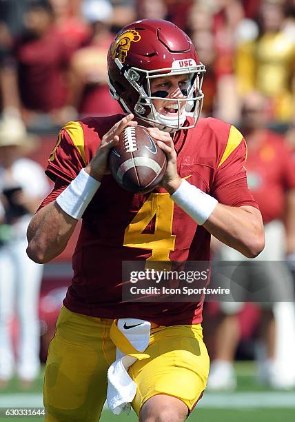 Trojans quarterback Max Browne back to pass in the first quarter of a game against the Utah State Aggies played at the Los Angeles Memorial Coliseum...