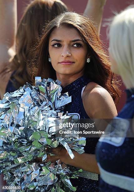 Utah State Aggies cheerleaders on the field during a game against the USC Trojans played at the Los Angeles Memorial Coliseum in Los Angeles, CA.