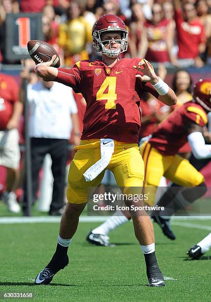 Trojans quarterback Max Browne back to pass in the first quarter of a game against the Utah State Aggies played at the Los Angeles Memorial Coliseum...