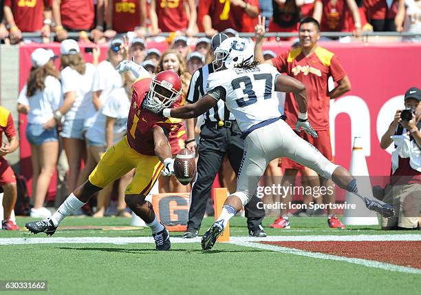 Trojans wide receiver Darreus Rogers tries to catch a pass in front of Utah State Aggies safety Devi Centers in the first quarter of a game played at...