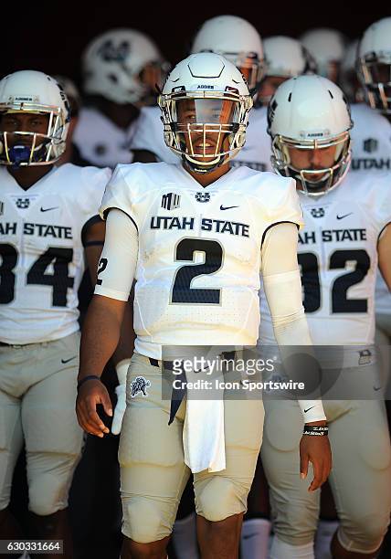 Utah State Aggies safety Dalin Leavitt heads for the field before a game against the USC Trojans played at the Los Angeles Memorial Coliseum in Los...