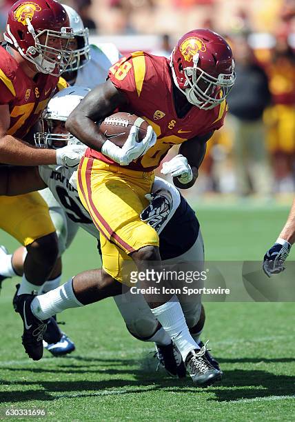 Trojans tail back Aca' Cedric Ware gains yards on a run in the fourth quarter of a game against the Utah State Aggies played at the Los Angeles...