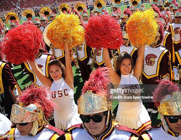 Trojans cheerleaders and band on the field after the Trojans defeated the Utah State Aggies 45 to 7 in a game played at the Los Angeles Memorial...