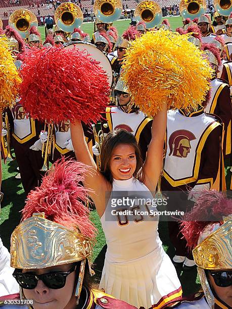 Trojans cheerleaders and band on the field after the Trojans defeated the Utah State Aggies 45 to 7 in a game played at the Los Angeles Memorial...