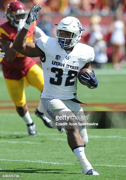Utah State Aggies running back Devante Mays ins for a gain during first quarter of a game against the USC Trojans played at the Los Angeles Memorial...