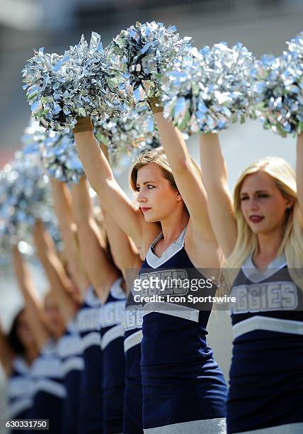 Utah State Aggies cheerleaders on the field during a game against the USC Trojans played at the Los Angeles Memorial Coliseum in Los Angeles, CA.