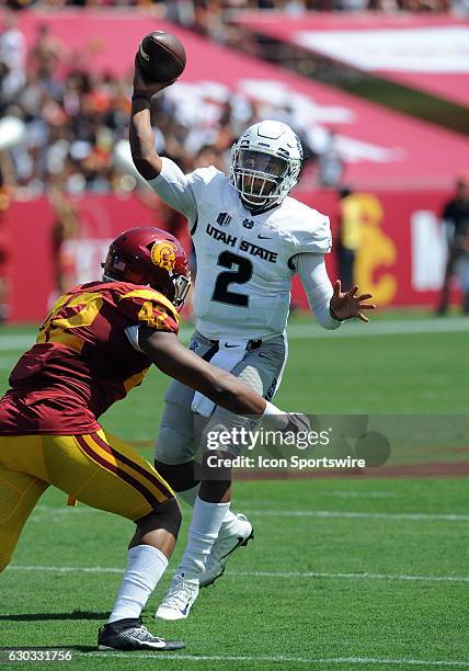 Utah State Aggies quarterback Kent Myers in action during the first quarter of a game against the USC Trojans played at the Los Angeles Memorial...