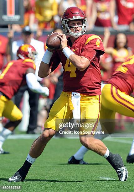 Trojans quarterback Max Browne back to pass in the first quarter of a game against the Utah State Aggies played at the Los Angeles Memorial Coliseum...