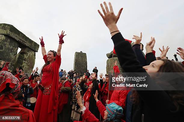 Druids, pagans and revellers gather in the centre of Stonehenge as they take part in a winter solstice ceremony at the ancient neolithic monument of...