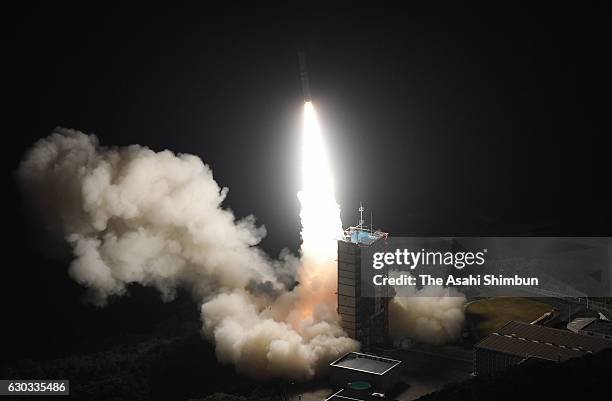 In this aerial image, the Epsilon-2 rocket carrying Exploration of energization and Radiation in Geospace satellite lifts off from the launch pad at...