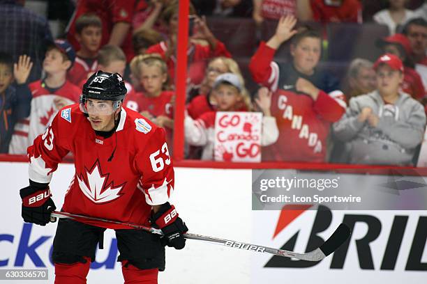 Brad Marchand up against the boards with some Canadian fans during the warmup before a game between Team Canada and Team USA during World Cup of...