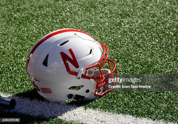 Nebraska Cornhuskers helmet rests on the field during the 52-17 Nebraska Cornhuskers victory over the Wyoming Cowboys at Memorial Stadium in Lincoln,...