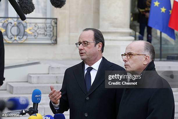 French President Francois Hollande flanked by French Prime minister, Bernard Cazeneuve makes a statement after a weekly cabinet meeting at the Elysee...
