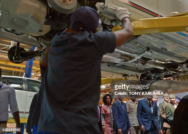 Kenyan President Uhuru Kenyatta , flanked by Volkswagen Brand CEO Herbert Diess and Volkswagen South Africa managing director Thomas Schaefer visits...