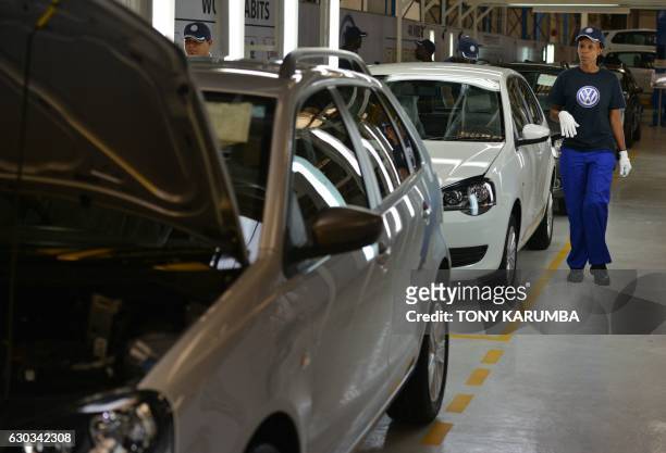 Technician works on new Polo Vivo Volkswagen models fresh off the assemply line at a newly opened plant on December 21, 2016 at Kenya's Thika town...