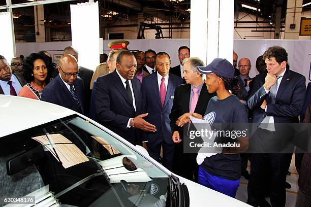 Kenyan President Uhuru Kenyatta and CEO of Volkswagen, Herbert Diess attend the inauguration ceremony of a new auto assembly line of the Volkswagen's...