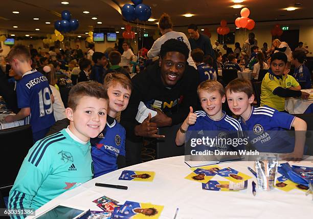 Ola Aina poses with young Chelsea fans as they attend the club's children's Christmas party at Stamford Bridge on December 21, 2016 in London,...