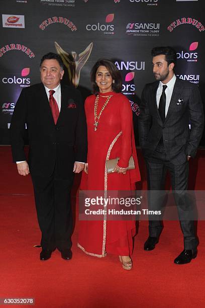 Bollywood actors Rishi Kapoor along with his wife Neetu Singh and son Ranbir Kapoor poses on red carpet for shutterbugs during the Sansui Colors...