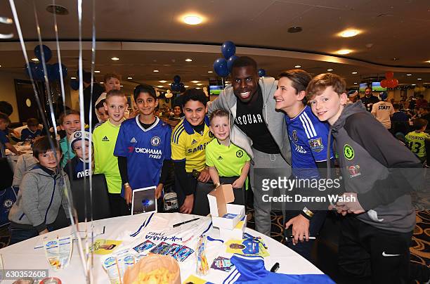 Kurt Zouma poses with young Chelsea fans as they attend the club's children's Christmas party at Stamford Bridge on December 21, 2016 in London,...