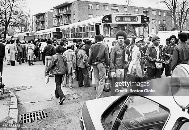 Black students wait to board buses on River Street in Mattapan after walking out of Hyde Park High School in Boston on the morning of April 11, 1978....