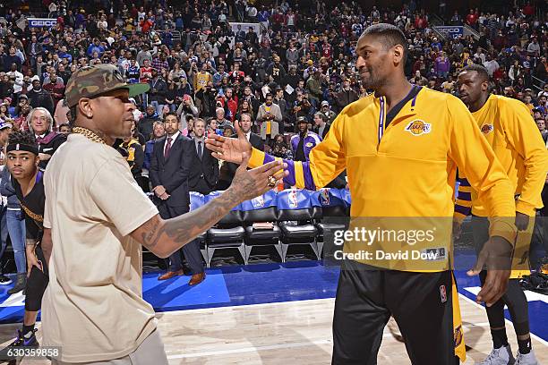 Hall of Famer, Allen Iverson shakes hands with Metta World Peace of the Los Angeles Lakers before the game against the Philadelphia 76ers at the...