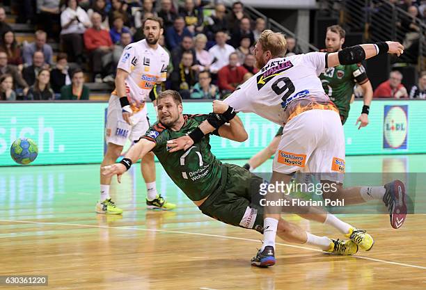 Kresimir Kozina of Fuechse Berlin and Manuel Spaeth of Frisch Auf Goeppingen during the game between Fuechse Berlin and Frisch Auf Goeppingen on...