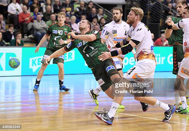 Paul Drux of Fuechse Berlin and Manuel Spaeth of Frisch Auf Goeppingen during the game between Fuechse Berlin and Frisch Auf Goeppingen on December...