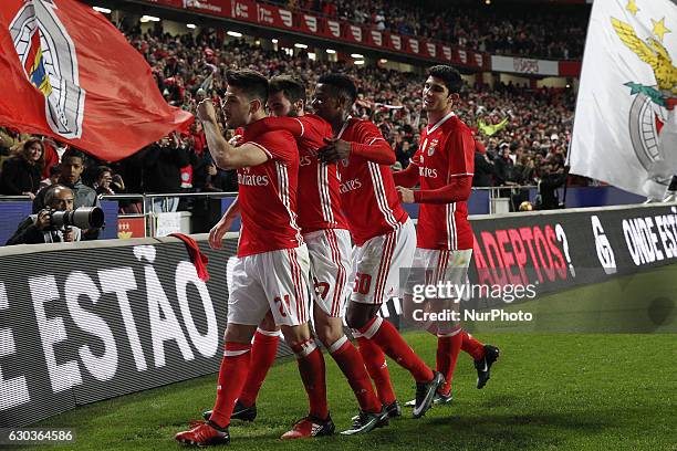 Benfica's forward Pizzi celebrates his goal with Benfica's midfielder Rafa Silva , Benfica's defender Nelson Semedo and Benfica's forward Goncalo...