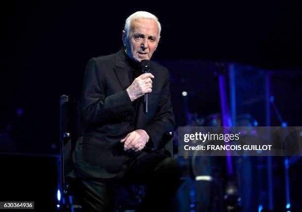 French-Armenian singer Charles Aznavour performs during a concert at the Palais des Sports in Paris on December 21, 2016.