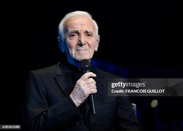 French-Armenian singer Charles Aznavour performs during a concert at the Palais des Sports in Paris on December 21, 2016.