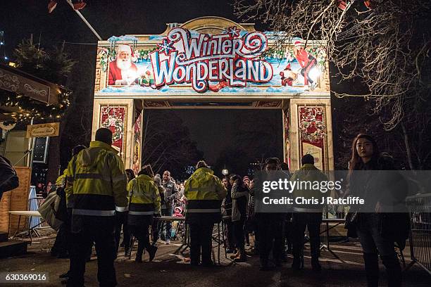 Security marshals check people's bags on entry to the Winter Wonderland in Hyde Park on December 21, 2016 in London, England. Winter Wonderland is an...