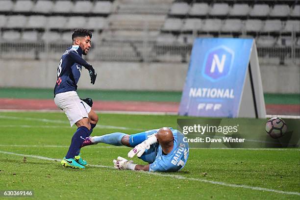 Saifeddine Alami Bazza of Paris FC beats goalkeeper Jeffrey Baltus of CA Bastia to score the only goal of the game during the National match between...