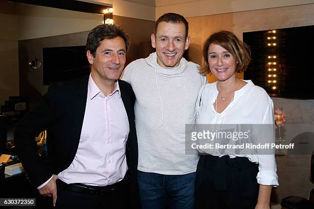 Humorist Dany Boon standing between TV Host Daniela Lumbroso and her husband Eric Ghebali pose Backstage after the triumph of the "Dany De Boon Des...