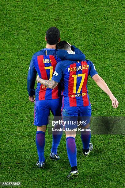 Paco Alcacer of FC Barcelona celebrates with his team mate Ardan Turan after scoring his team's fifth goal during the Copa del Rey round of 32 second...