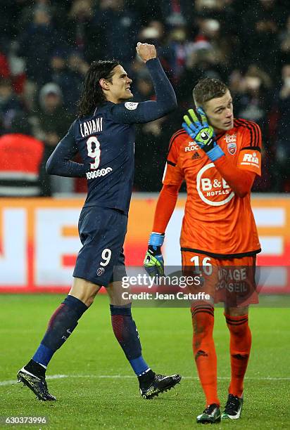 Edinson Cavani of PSG celebrates his goal on a penalty kick while goalkeeper of Lorient Paul Delecroix looks dejected during the French Ligue 1 match...