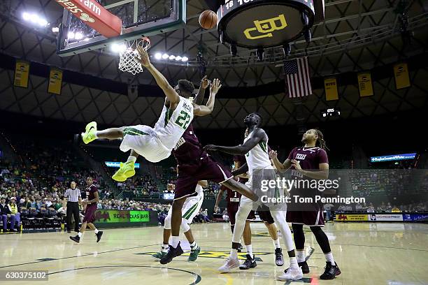 King McClure of the Baylor Bears is fouled by Derrick Griffin of the Texas Southern Tigers in the first half at Ferrell Center on December 21, 2016...