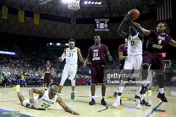 King McClure of the Baylor Bears is fouled by Derrick Griffin of the Texas Southern Tigers in the first half at Ferrell Center on December 21, 2016...
