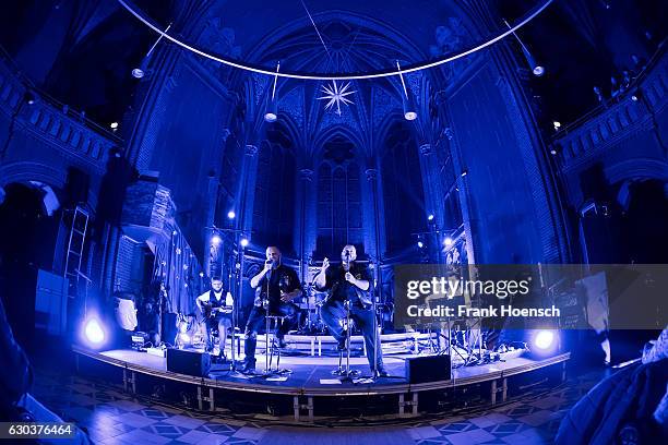 Singer Hagen Stoll and Sven Gillert of the German band Haudegen perform live during a concert at the Apostel-Paulus-Kirche on December 21, 2016 in...