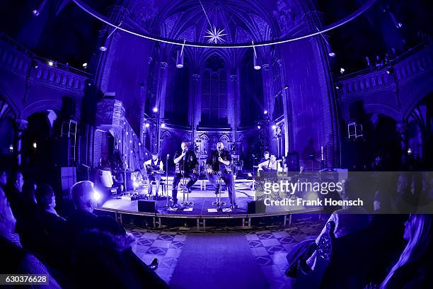 Singer Hagen Stoll and Sven Gillert of the German band Haudegen perform live during a concert at the Apostel-Paulus-Kirche on December 21, 2016 in...