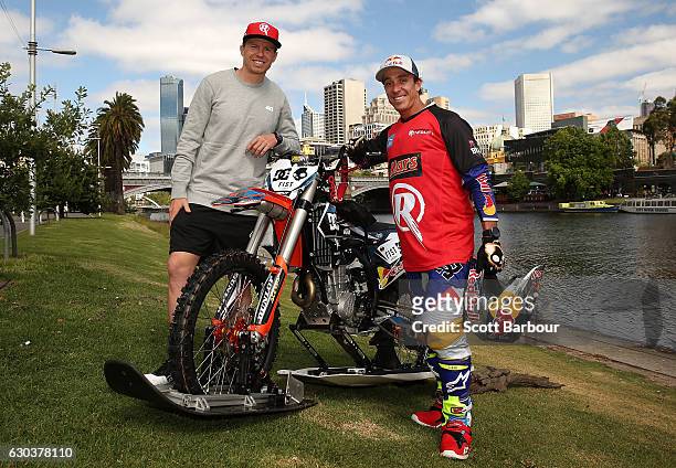 Australian FMX rider Robbie Maddison poses with Australian cricketer Peter Siddle of the Melbourne Renegades after riding his motorbike along the...