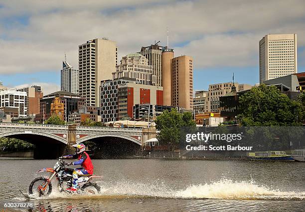 Australian FMX rider Robbie Maddison rides his motorbike along the surface of the Yarra River on December 22, 2016 in Melbourne, Australia. The...