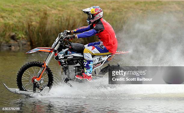 Australian FMX rider Robbie Maddison rides his motorbike along the surface of the Yarra River on December 22, 2016 in Melbourne, Australia. The...