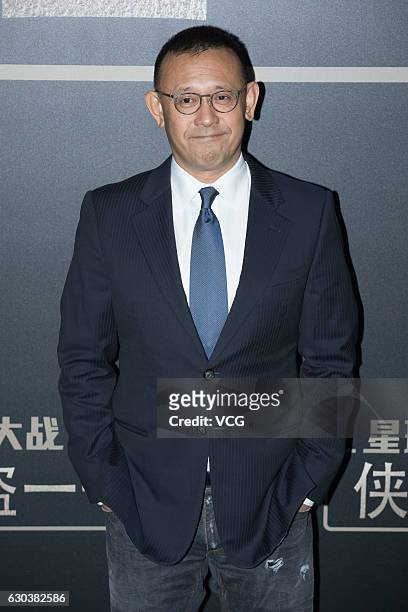 Actor Jiang Wen arrives on the red carpet for the premiere of film "Rogue One: A Star Wars Story" on December 21, 2016 in Beijing, China.