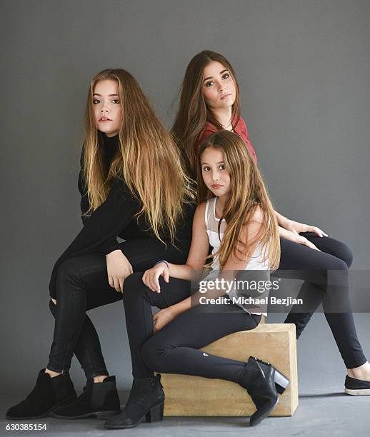 Neriah Fisher, Sierra Fisher and Rain Charvet pose for portrait at Brooke Burke Visits The Artists Project on December 21, 2016 in Los Angeles,...