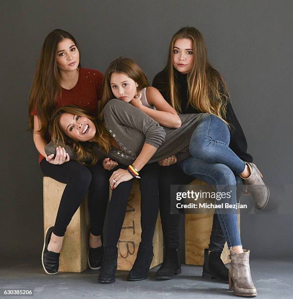 Sierra Fisher, Rain Charvet, and Neriah Fisher pose with actress Brooke Burke for portrait at Brooke Burke Visits The Artists Project on December 21,...