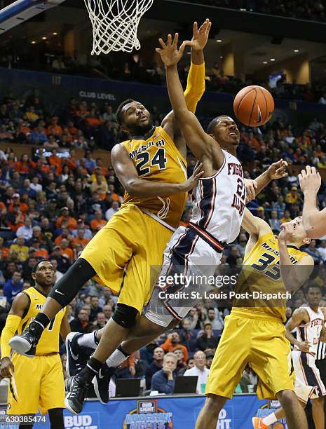 Illinois guard Malcolm Hill, right, is fouled by Missouri forward Kevin Puryear as he drives to the basket in the second half on Wednesday, Dec. 21,...